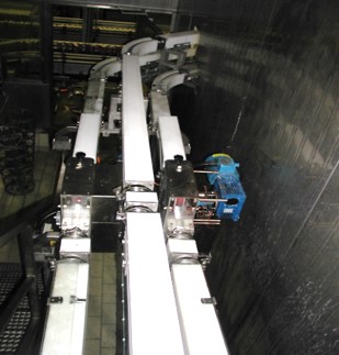 Automazione messa in linea di tappi per lattine
